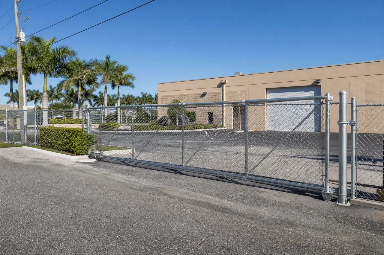 Galvanized commercial chain link fence with a rolling gate